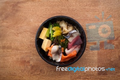 Japanese Food Tekka Don Take Away On Wooden Background Stock Photo