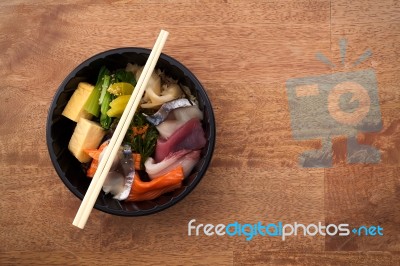 Japanese Food Tekka Don Take Away On Wooden Background Stock Photo