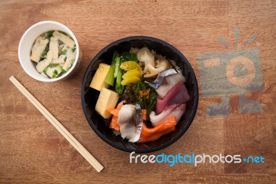 Japanese Food Tekka Don Take Away On Wooden Background Stock Photo