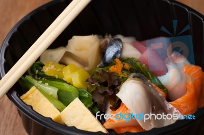 Japanese Food Tekka Don Take Away On Wooden Background Stock Photo