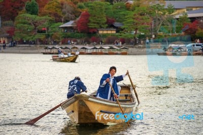 Japanese Oar People Sail Boat At Arashiyama Stock Photo