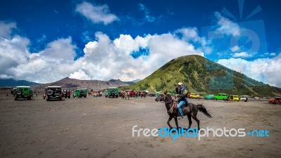 Java,indonesia-arpil 24,2017 : A Horseman At Mount Bromo Of Bromo-tengger-semeru National Park In Indonesia Stock Photo