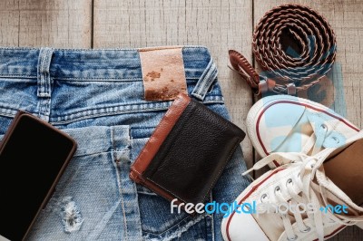 Jeans And Dress On Wooden Stock Photo