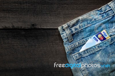 Jeans Lack And And Credit Card On The Wooden Floor Stock Photo