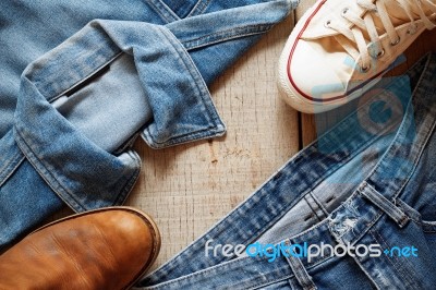 Jeans On A Wooden Floor Stock Photo