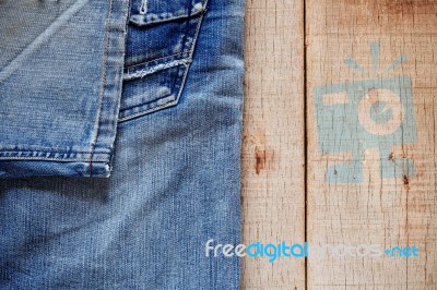 Jeans On The Old Wooden Stock Photo