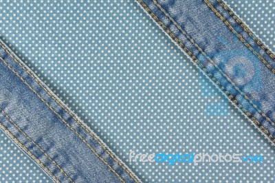 Jeans With Stitch On Blue Dot Fabric Stock Photo