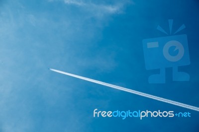 Jet Airplane With Trail Of Fuel Stock Photo