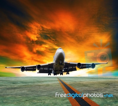 Jet Plane Flying Over Runways And Beautiful Dusky Sky With Copy Stock Photo