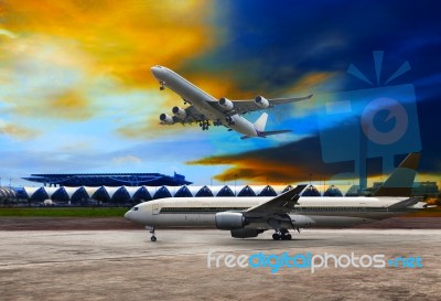 Jet Plane Flying Over Runways And Beautiful Dusky Sky With Copy Stock Photo