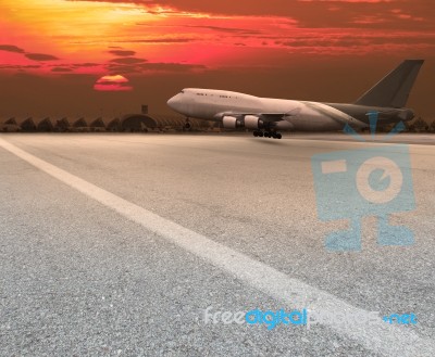 Jet Plane Landing On Runway Stock Photo