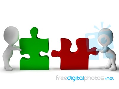 Jigsaw Pieces Being Joined Shows Teamwork And Collaboration Stock Image