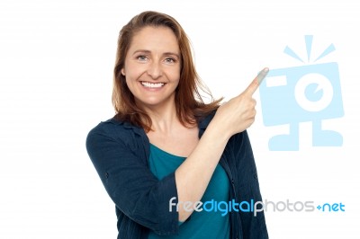 Joyous Smart Woman Pointing Away Stock Photo