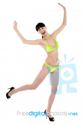 Joyous Woman In Green Lingerie Dancing In Joy Stock Photo