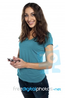 Joyous Woman Messaging Her Boyfriend Stock Photo