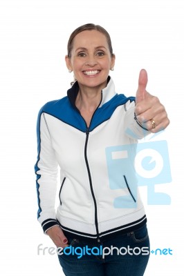 Joyous Woman Showing Thumbs Up Gesture Stock Photo