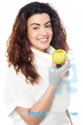 Joyous Woman With An Apple In Hand Stock Photo