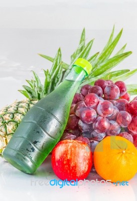 Juices And Fruits On Background Stock Photo