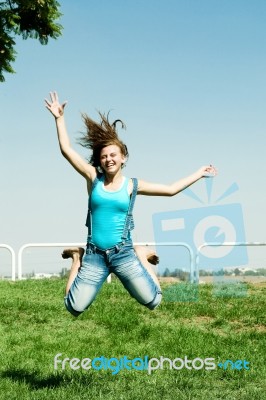 Jumping Girl In Outdoor Stock Photo