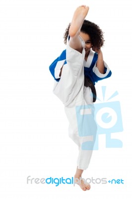 Karate Girl Kick A Leg Stock Photo