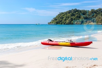 Kayaks On The Tropical Beach With Beautiful Sky Stock Photo