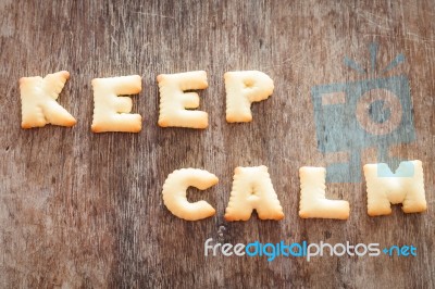 Keep Calm Alphabet Biscuit On Wooden Table Stock Photo