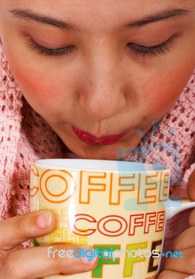 Keeping Snug And Warm With Coffee Stock Photo