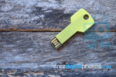 Key Usb Data Storage Isolated On Wooden Background Stock Photo