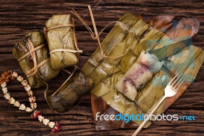 Khao Tom Mat - Thai Dessert - Sticky Rice, Banana And Black Beans Wrapped In Banana Lea Stock Photo