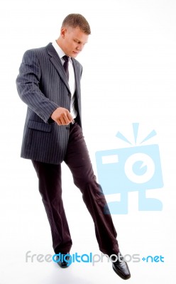 Kicking Young Businessman Stock Photo