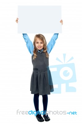 Kid Holding Blank Billboard Above Her Head Stock Photo