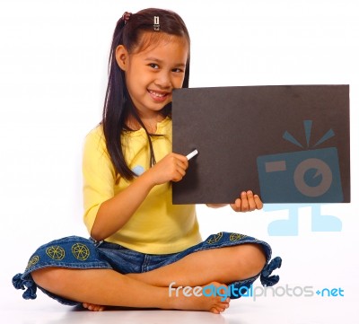 Kid Holding Board For Writing Stock Photo