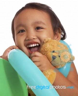 Kid Holding Teddy Bear Stock Photo