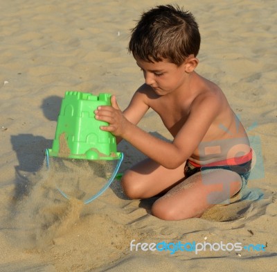 Kid On The Beach Stock Photo