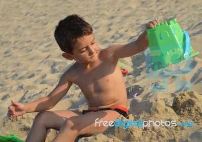 Kid On The Beach Stock Photo