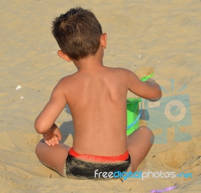 Kid On The Beach Stock Photo