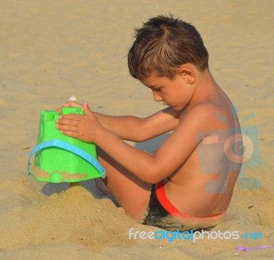 Kid On The Beach Stock Photo