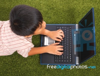 Kid Using His Computer Stock Photo