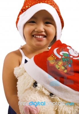 Kid With Toy And Santa Hats Stock Photo