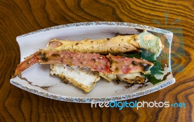 King Crab Legs On Wooden Table Stock Photo