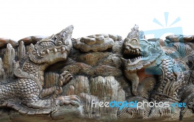 King Of Nagas & Kylin Carving On Teak Stock Photo