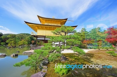 Kinkakuji Temple At Autumn Against Blue Sky Stock Photo