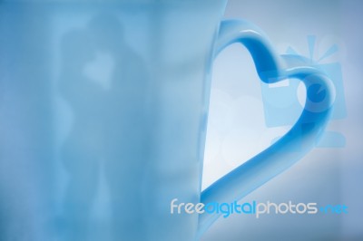 Kissing Couple Reflected On Cup Stock Photo