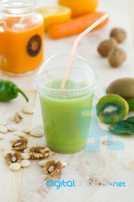 Kiwi Juice, Nuts And Fresh Fruits On Wooden Background Stock Photo