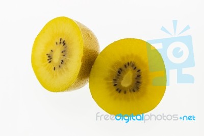 Kiwi Slices Into Half On White Background Stock Photo