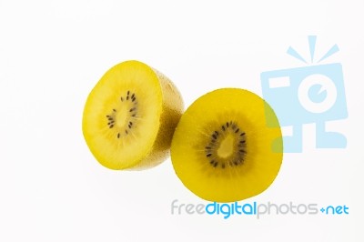 Kiwi Slices Into Half On White Background Stock Photo