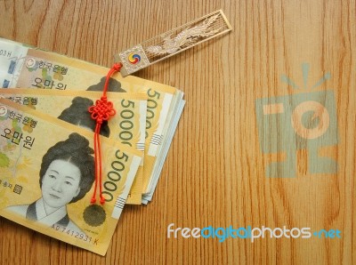 Korean Money With Good Luck Charm Stock Photo