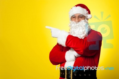 Kris Kringle Gesturing Towards The Copy Space Area Stock Photo