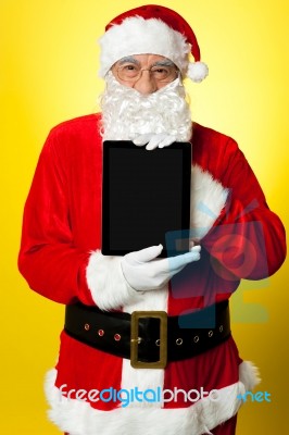 Kris Kringle Presenting New Updated Tablet Pc Stock Photo