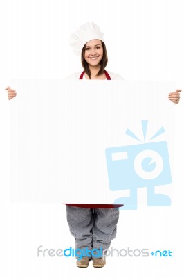 Lady Chef Holding Blank Billboard Stock Photo